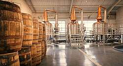 Stills and barrels at the Connacht distillery